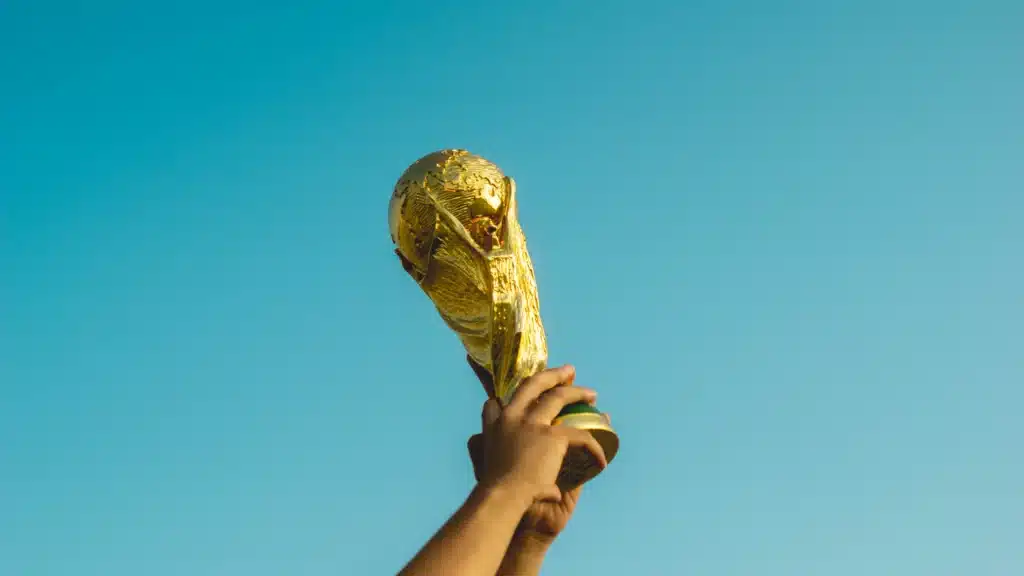 Holding the FIFA World Cup thropy